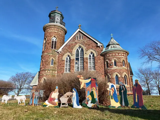 St. Mary's Roman Catholic Church in Souris, Prince Edward Island, a red sandstone Catholic church with a corner bell tower.